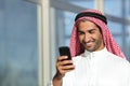 Arab saudi businessman working with his phone