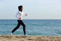 Arab saudi runner woman running on the beach