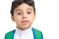 Arab school boy closeup on face with a smile and broken tooth, wearing white traditional Saudi Thobe, back pack and sneakers,