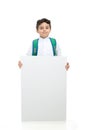 Arab school boy holding a big white board with both hands, wearing white traditional Saudi Thobe and sneakers, raising his hands