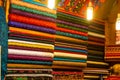 Arab store selling a variety of fabrics, Fabric in rolls