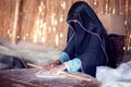 Arab woman makes bread in the beduin village in Egypt Royalty Free Stock Photo