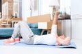 Arab woman doing gymnastics in the bedroom. Royalty Free Stock Photo