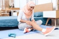 Arab woman doing gymnastics in the bedroom. Royalty Free Stock Photo