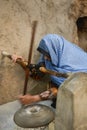 Arab woman grinding