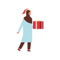 Arab woman hold gift box present merry christmas happy new year holiday celebration concept full length female cartoon