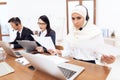 An Arab woman works in a call center. Royalty Free Stock Photo