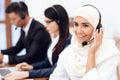 An Arab woman works in a call center. Royalty Free Stock Photo