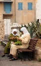 Arab women preparing spices