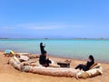 Arab women rest on a beach chill out with turquoise waters on the coast of the Sinai Peninsula. Remote