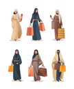 arab women in traditional clothes holding shopping bags season big sale special offer promotion discount vertical Royalty Free Stock Photo