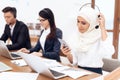 An Arab woman works in a call center. Royalty Free Stock Photo