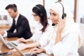 An Arab woman works in a call center. Royalty Free Stock Photo