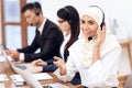 An Arab woman works in a call center. Royalty Free Stock Photo