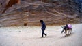 Arab young boy with donkycanyon ancient city of Petra in Jordan Royalty Free Stock Photo