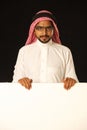 Arab young man with ad space. Royalty Free Stock Photo