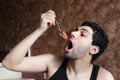 Arab young man eating chocolate nutella