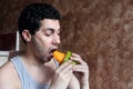 Arab young man eating mango fruit Royalty Free Stock Photo