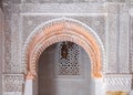 Arabesque carved plaster above an archway in a Moroccan medersa