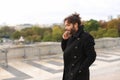 Arabian boy walking near Eiffel Tower with smartphone in slow mo Royalty Free Stock Photo