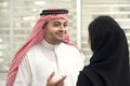 Arabian Business man having a discussion with an arabian businesswoman in the office Royalty Free Stock Photo