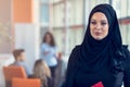 Arabian business woman holding a folder in modern startup office Royalty Free Stock Photo