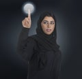 Arabian business woman pressing a touchscreen