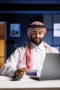 Arabian businessman browsing online efficiently Royalty Free Stock Photo