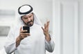 Arabian Businessman expressing anger on the phone
