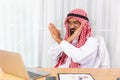 Arabian businessman feeling disappoint and say no while talking with his business partner by video conference on notebook in his Royalty Free Stock Photo