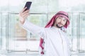 Arabian businessman taking self portrait Royalty Free Stock Photo