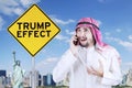 Arabian businessman with Trump Effect word