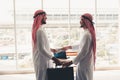 Arabian businessmen are handshake after successful dealing., Portrait of Arab businessman shaking hands to his business partner in Royalty Free Stock Photo