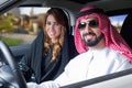 Arabian couple in a newely purchased car