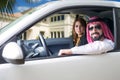 Arabian couple in a newely purchased car