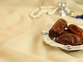 Arabian dates with pearl beads masbah and perfume bokeh Royalty Free Stock Photo