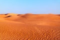 Arabian desert dune background on blue sky