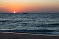 Arabian dhow in ocean at sunrise at Ras al Jinz in Oman