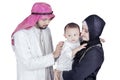 Arabian doctor checking baby health