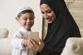 Arabian family, Arabian mother and son using mobile phone Royalty Free Stock Photo