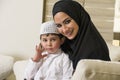 Arabian family, mother and son sitting on the couch Royalty Free Stock Photo