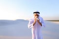 Arabian guy feels unpleasant sensations with cold, standing in m