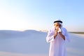 Arabian guy feels unpleasant sensations with cold, standing in m