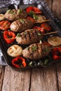 Arabian kebab with grilled vegetables on the grill pan. vertical