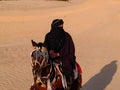 Arabian knight in the desert at sunset, Douz Tunisia, sahara desert Royalty Free Stock Photo