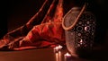 Arabian lantern near a red oriental fabric on a brown wooden background.Eid lamp or lantern for Ramadan and other Islamic Muslim