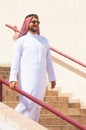 Arabian man going downstairs Royalty Free Stock Photo