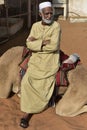 Arabian Man Sitting on his Dromedary