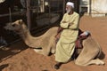 Arabian Man Sitting on his Dromedary