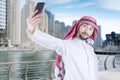 Arabian man taking self portrait